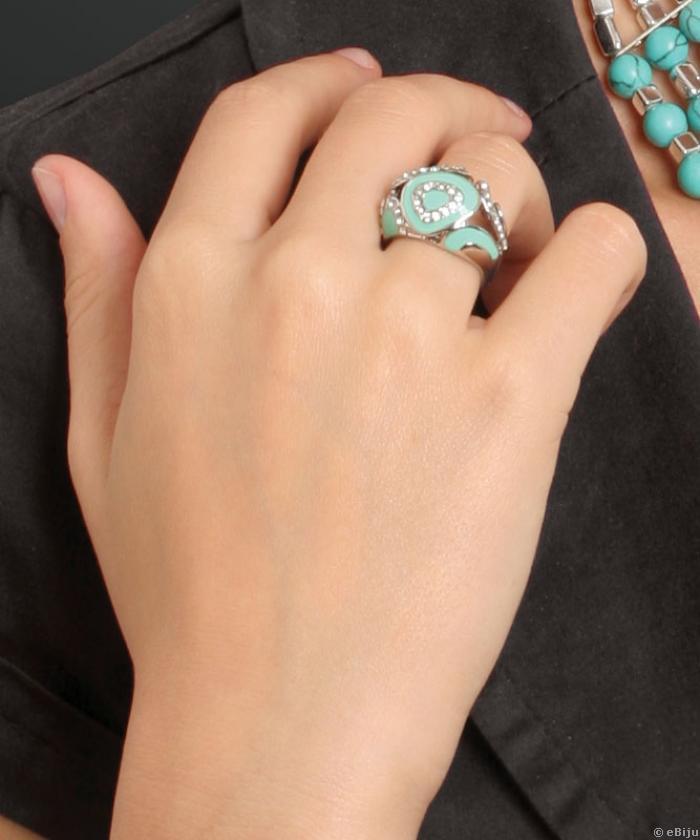 Türkizkék gyűrű, kör formák fehér kristályokból kirakva